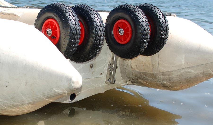 Flip up dual boat launching wheels 